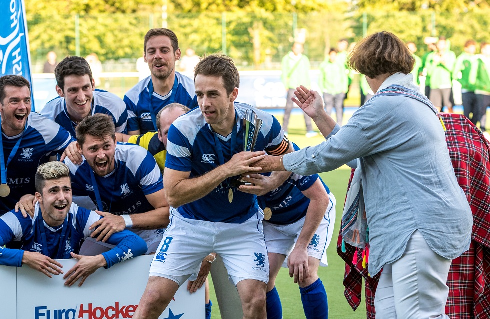 Chris Grassick lifts the EuroHockey Championship II trophy