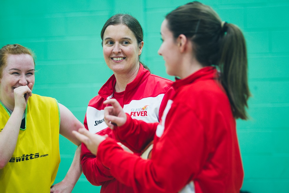 Adrienne Hunter jokes with her players