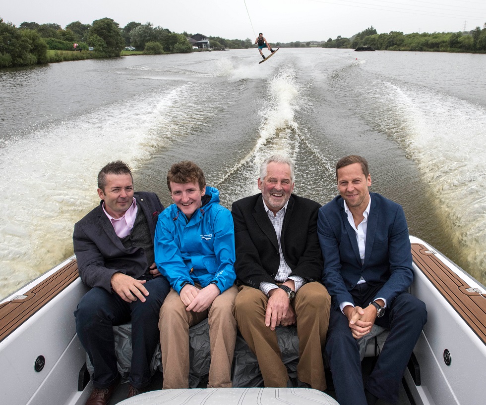 Alan Murray and others in a boat