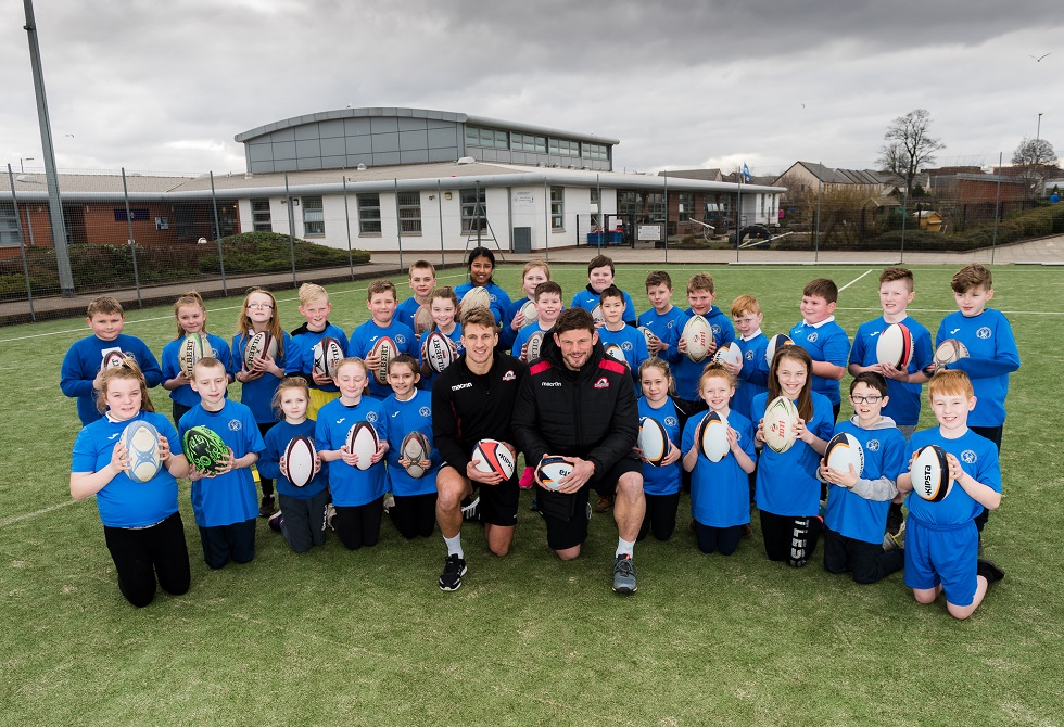 Tom Brown and Ross Ford with children from Broomhouse Primary School