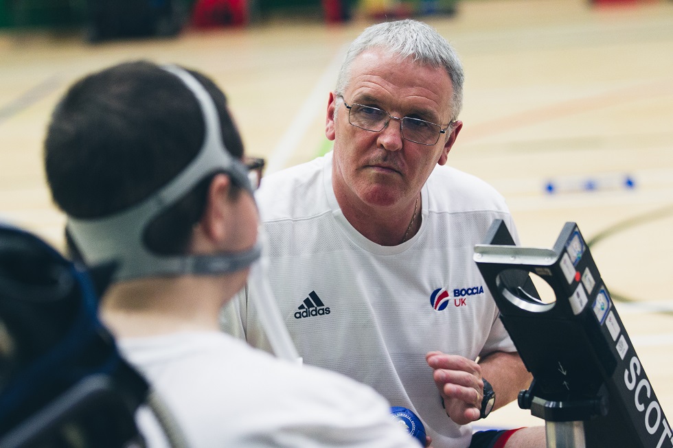 Gary McCowan working as boccia ramp assistant to his son Scott at sportscotland Inverclyde