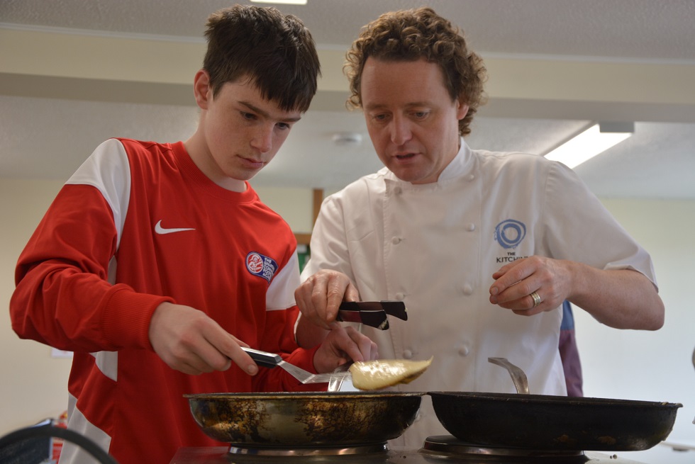 Tom Kitchin with a member of The Spartans Community Football Academy