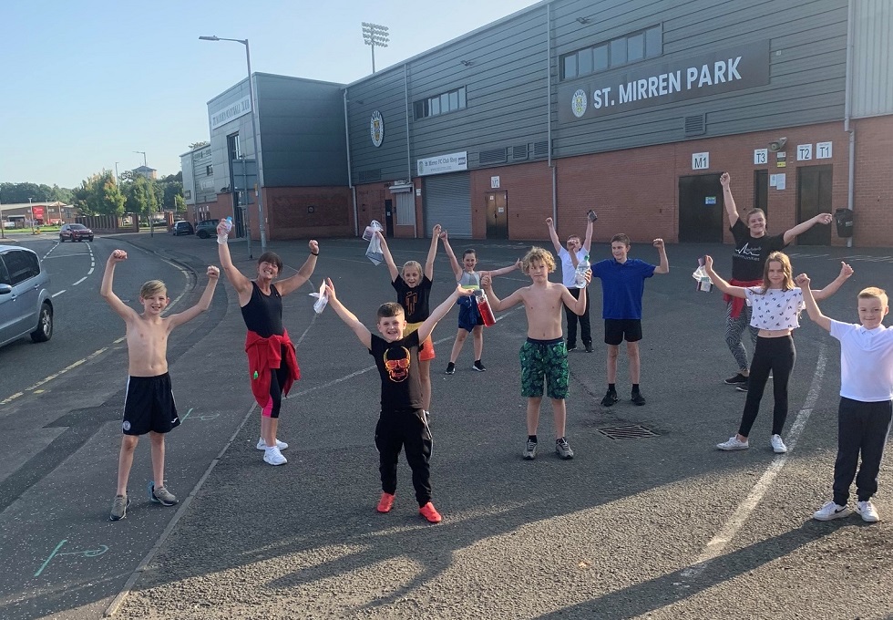 Karen Campbell with a youth group taking part in an exercise session outside St Mirren Park in Paisley