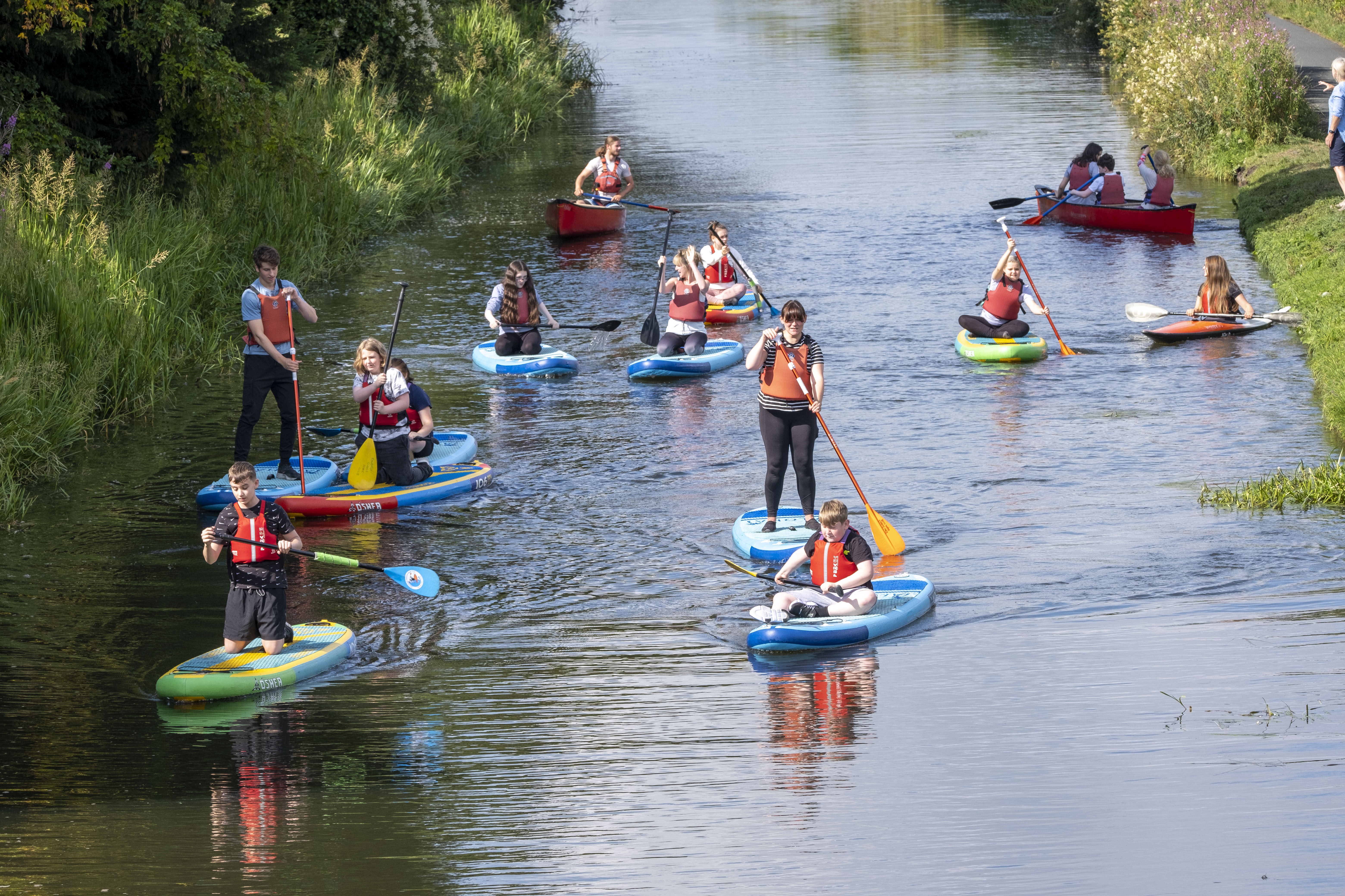 Young carers paddleboarding