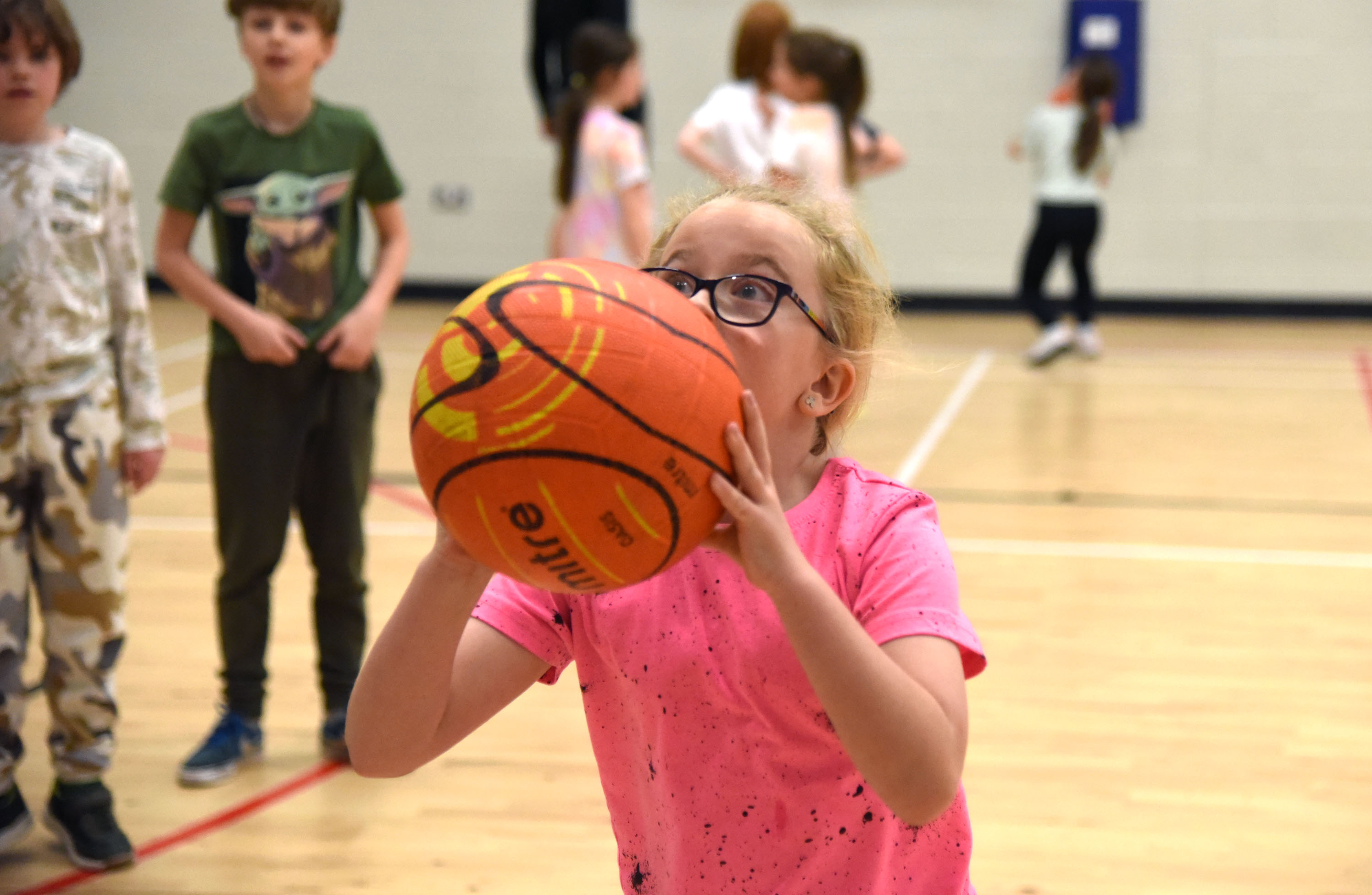 young participant playing basketball