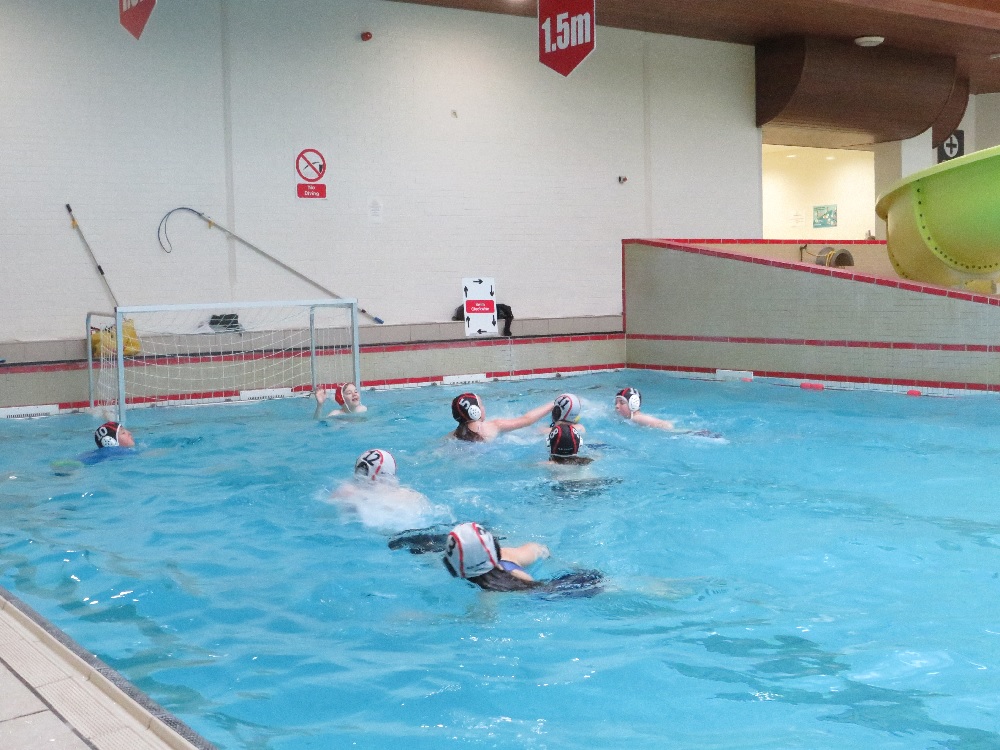 Young people playing water polo