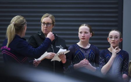 Angela Turner with para gymnasts at artistic champs 2026.jpg